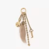 Chloé Symbols Taschenanhänger aus Messing und Lammfell Chloé Symbols Taschenanhänger aus Messing und Lammfell