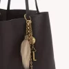 Chloé Symbols Taschenanhänger aus Messing und Lammfell Chloé Symbols Taschenanhänger aus Messing und Lammfell