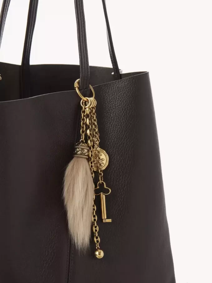 Chloé Symbols Taschenanhänger aus Messing und Lammfell Chloé Symbols Taschenanhänger aus Messing und Lammfell