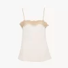 Figurbetontes Tanktop aus bestickter Spitze Figurbetontes Tanktop aus bestickter Spitze
