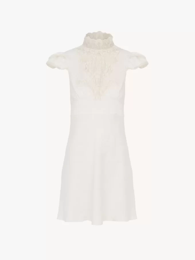 Hochgeschlossenes Minikleid aus Jacquard-Seide und Spitze Hochgeschlossenes Minikleid aus Jacquard-Seide und Spitze