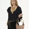 Kleine Bracelet-Handtasche aus genarbtem Leder Kleine Bracelet-Handtasche aus genarbtem Leder