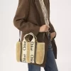 Kleine Woody-Tragetasche aus Lammfell Kleine Woody-Tragetasche aus Lammfell