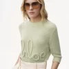Pullover mit Logo und Ellenbogenärmeln aus Alpakawolle und Seidenstrick Pullover mit Logo und Ellenbogenärmeln aus Alpakawolle und Seidenstrick