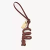 Taschenanhänger mit Logo aus glänzendem Leder Taschenanhänger mit Logo aus glänzendem Leder